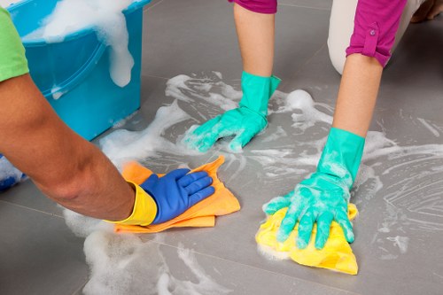After builders cleaning team removing construction dust in an Ilford home