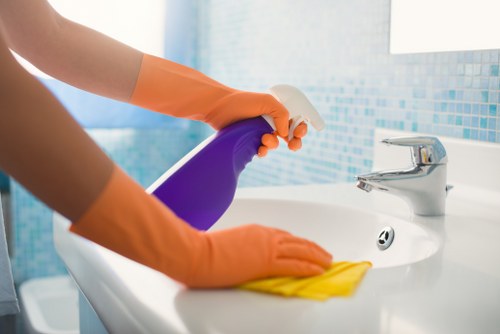 Technician treating stains on a mattress during deep cleaning